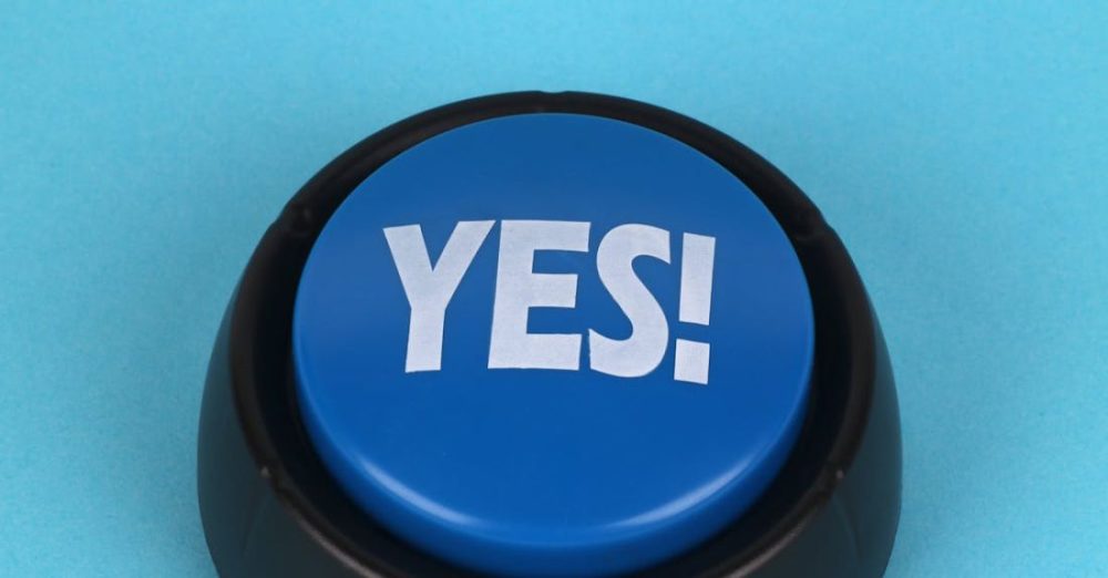 Communication Tools - A blue button with the word yes on it