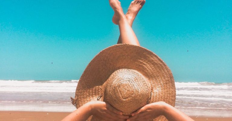 Vacations - Person Laying On Sand