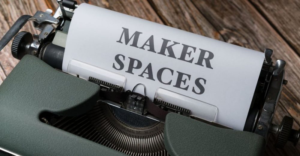 Collaborative Workspaces - A typewriter with the words maker spaces written on it