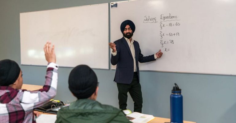 Whiteboards - Teacher Teaching Mathematics in a Classroom